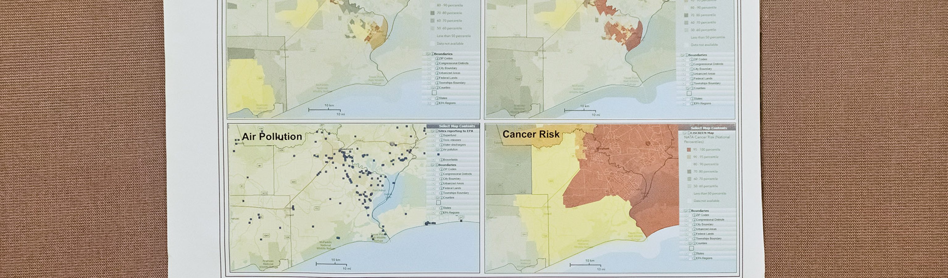 An environmental map from Texas Southern University shows pollution risks in Jefferson County, Texas and hangs on display during CEER’s People’s Hearing event April 30, 2022 in Houston, Texas.