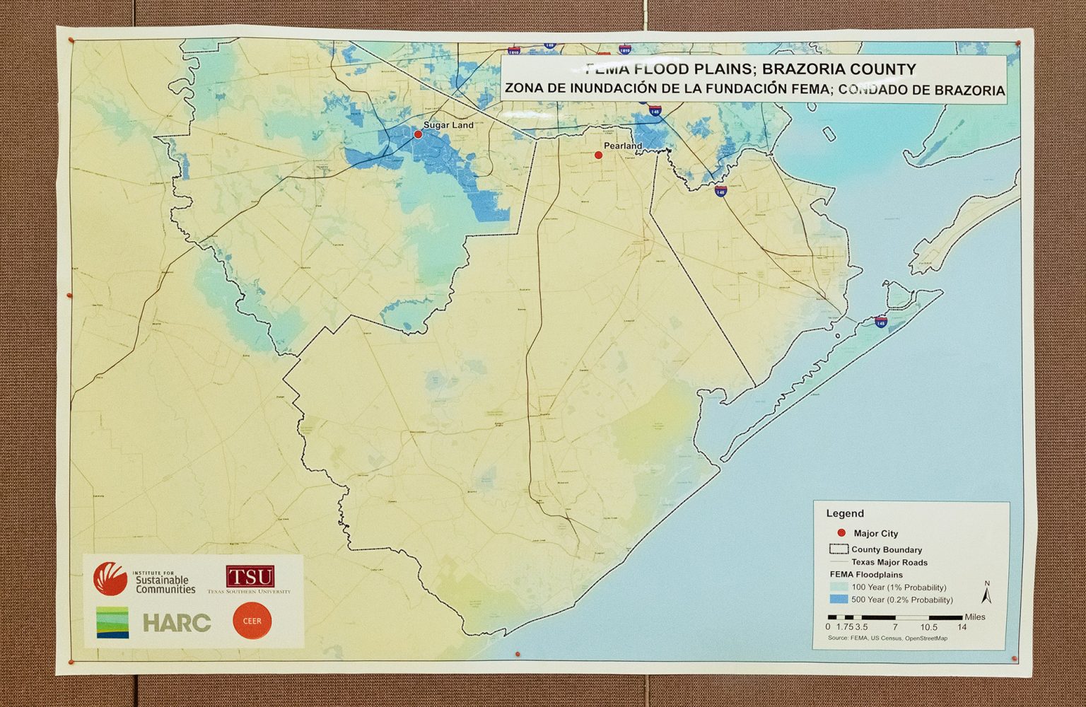 A map from Texas Southern University shows FEMA flood plains in Brazoria County, Texas and hangs on display during CEER’s People’s Hearing event April 30, 2022 in Houston, Texas.
