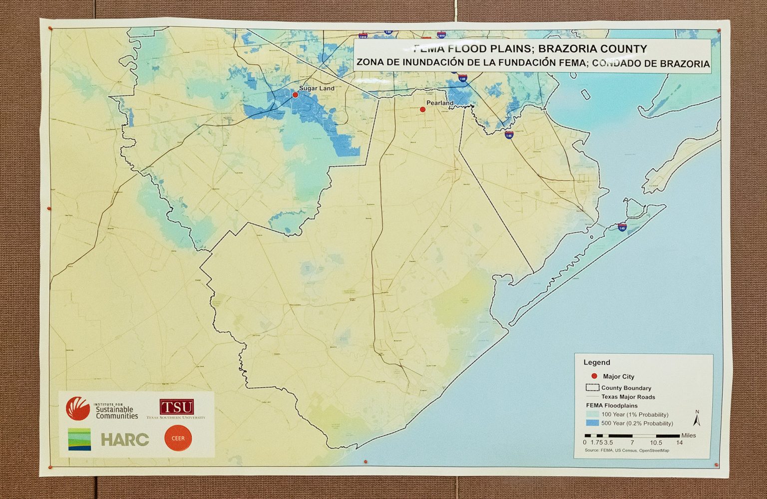 A map from Texas Southern University shows FEMA flood plains in Brazoria County, Texas and hangs on display during CEER’s People’s Hearing event April 30, 2022 in Houston, Texas.